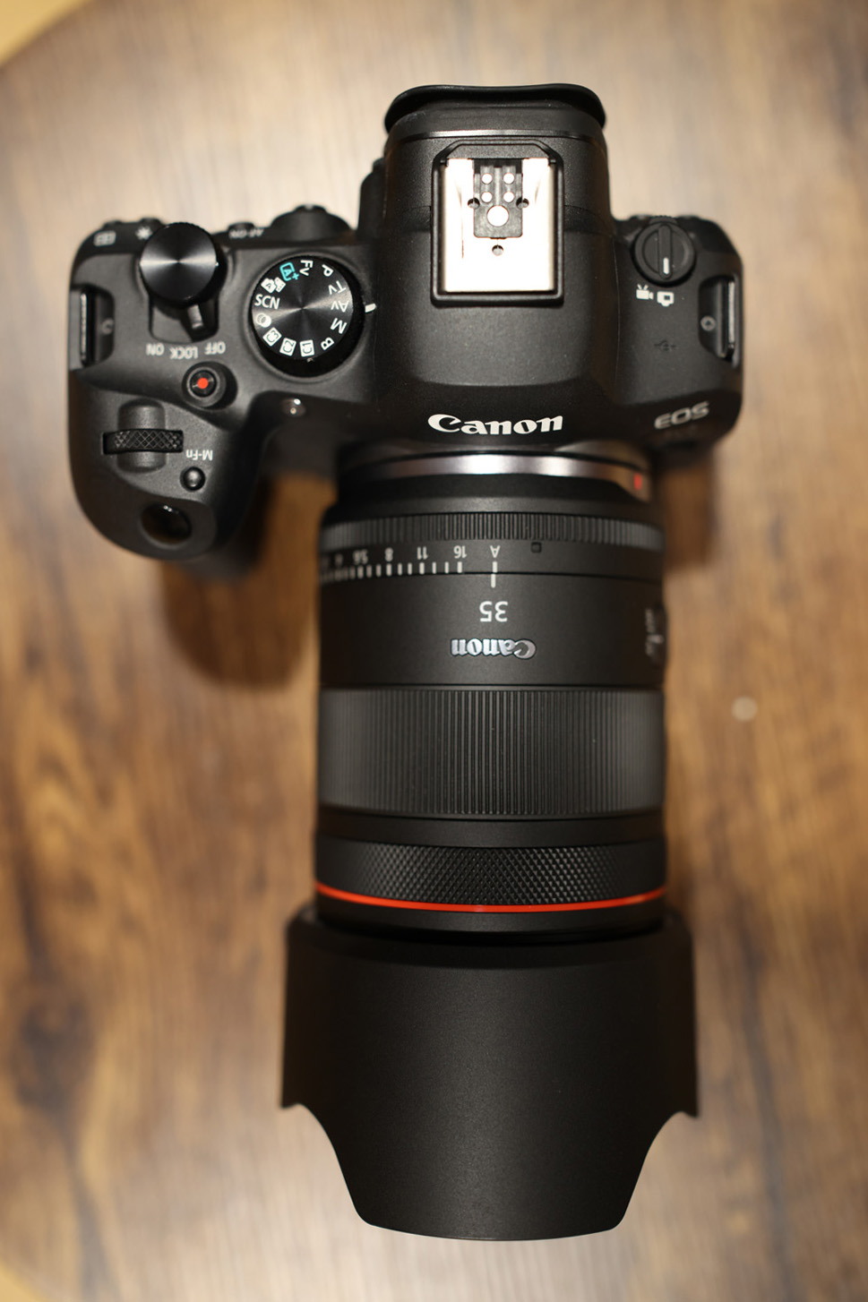 Canon RF35mm f/1.4 L VCM attached to camera on table